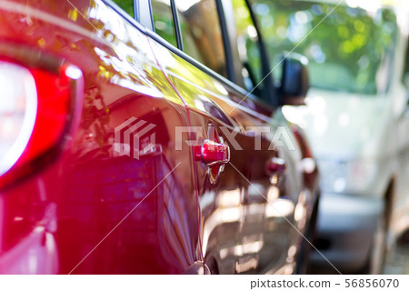 Side view of turning luxury car in motion Side view of turning luxury car in motion 56856070