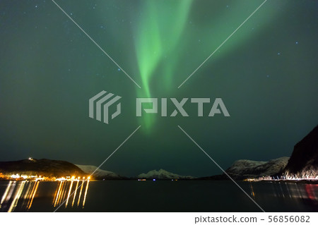 Beautiful northern lights over a fjord at night Beautiful northern lights over a fjord at night 56856082