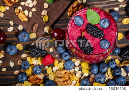 Glass of smoothies with fresh berries 56856808
