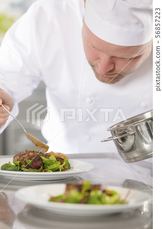 Professional chef prepare meat dish at restaurant Professional chef prepare meat dish at restaurant 56857223