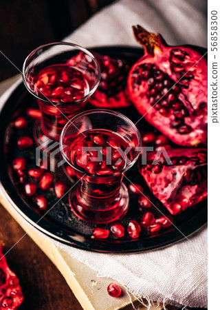 Shots of pomegranate cocktail Shots of pomegranate cocktail 56858300