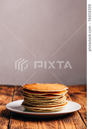 Stack of american pancakes on white plate 56858309