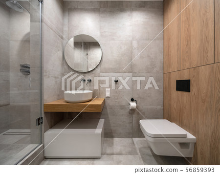 Stylish modern bathroom with light tiled walls and floor 56859393