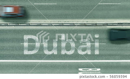 Aerial top-down view of the road. Cars reveal Dubai text. Travel to United arab emirates 3D 56859394