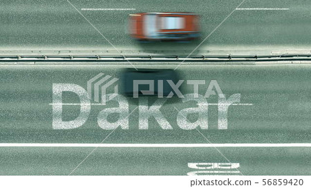 Aerial down view of the motorway with cars revealing Dakar caption. Car travel to Senegal 3D Aerial down view of the motorway with cars revealing Dakar caption. Car travel to Senegal 3D 56859420