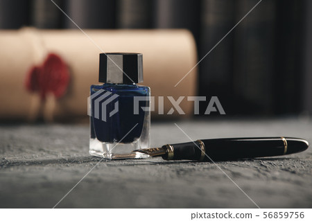 Lawer and notery concept. Pen-juice and pen on the table. Lawer and notery concept. Pen-juice and pen on the table. 56859756