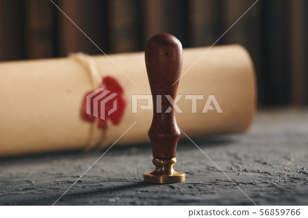Red wax stamp on the paper document isolated. 56859766