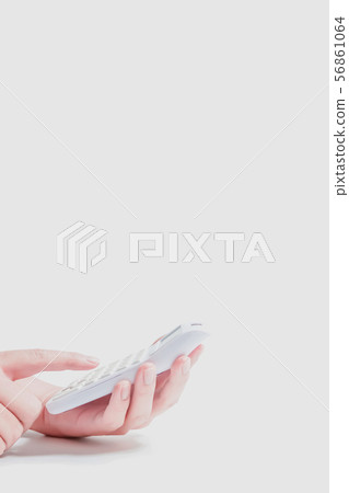 Close-up of calculator and hand using calculator Close-up of calculator and hand using calculator 56861064
