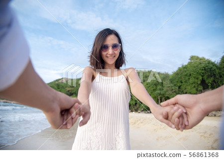 Couple lover hold hands together on tropical Couple lover hold hands together on tropical 56861368