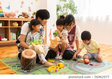 Nursery school with children playing in the nursery Nursery school with children playing in the nursery 56862077