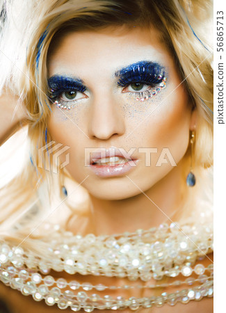 bright blond young woman with fashion style makeup posing sensual bright blond young woman with fashion style makeup posing sensual 56865713