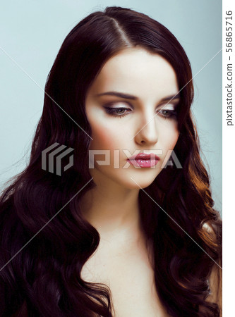 young pretty brunette woman with hairstyle waves, luxury look fashion makeup close up 56865716
