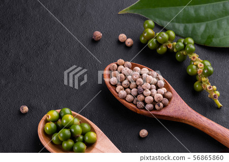 Farm fresh green peppercorns isolated on wood 56865860
