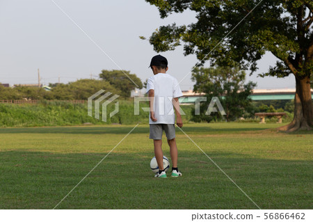 A boy playing football 56866462