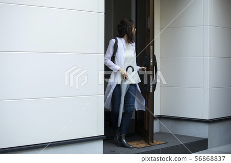 Women going out on a rainy day 56868837