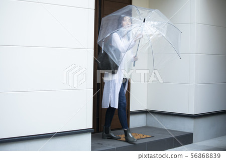 Women going out on a rainy day 56868839