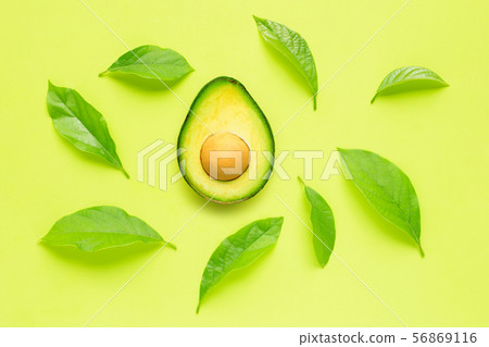 Avocado  with leave on green background. 56869116