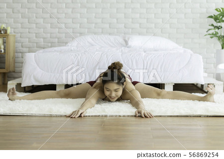 Asian woman practice yoga exercise in bedroom 56869254