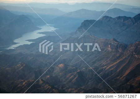 Image of picturesque mountain landscape, river, foggy sky in summer 56871267