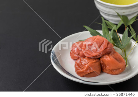Umeboshi and Japanese tea luxury copy space on black background Umeboshi and Japanese tea luxury copy space on black background 56871440