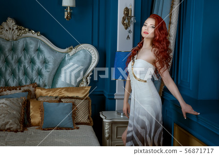 Beautiful red-haired woman in expensive Beautiful red-haired woman in expensive 56871717