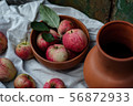 Apple and jug composition 56872933