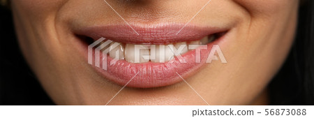 Wide open confident smile of pretty mature woman 56873088