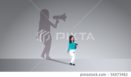 girl dreaming about being manager or boss screaming in megaphone shadow of business woman with 56873462