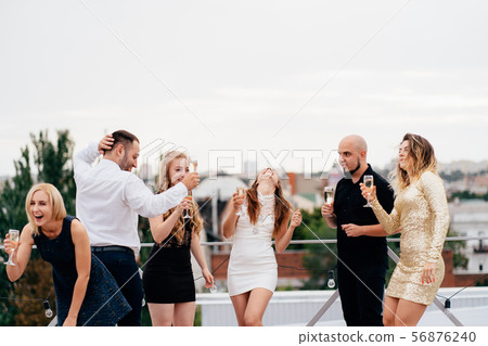 Happy friends with drinks, celebrating special day Happy friends with drinks, celebrating special day 56876240