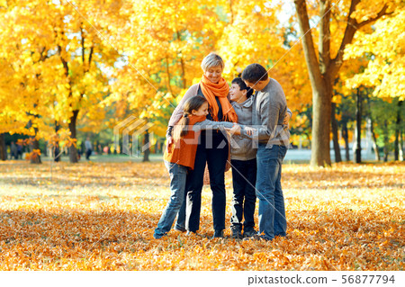 Happy family posing, playing and having fun in 56877794