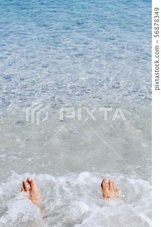 young man relaxing on the seashore. 56878349