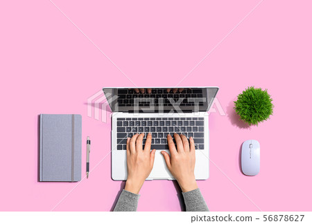 Person using a laptop computer Person using a laptop computer 56878627