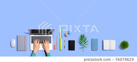 Person using a laptop computer Person using a laptop computer 56878629
