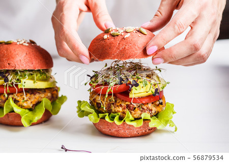 Cooking pink vegan burgers with beans cutlet 56879534