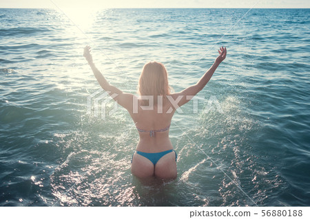 Young beautiful smiling woman with red hair in Young beautiful smiling woman with red hair in 56880188