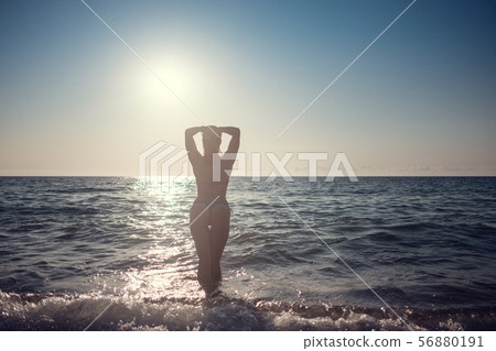 Young beautiful smiling woman with red hair in Young beautiful smiling woman with red hair in 56880191