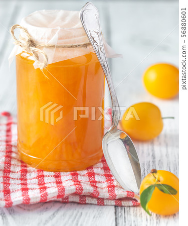 Glass jar of plum jam 56880601