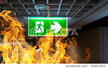 Green fire escape sign hang on the ceiling in the Green fire escape sign hang on the ceiling in the 56881952