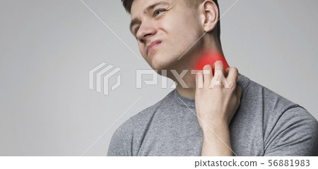 Young man scratching his itchy neck with allergy rash Young man scratching his itchy neck with allergy rash 56881983