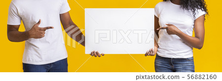 Black guy and girl holding white blank card 56882160