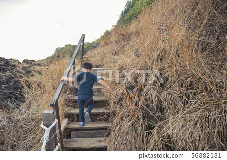 Healthy young boy climb  and hike 56882181