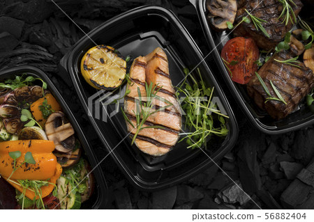 Set of grilled vegetables, fish and meat in delivery boxes Set of grilled vegetables, fish and meat in delivery boxes 56882404