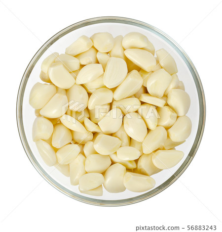 Peeled garlic cloves in glass bowl, from above Peeled garlic cloves in glass bowl, from above 56883243
