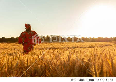 African woman in traditional clothes At Sunset 56883473