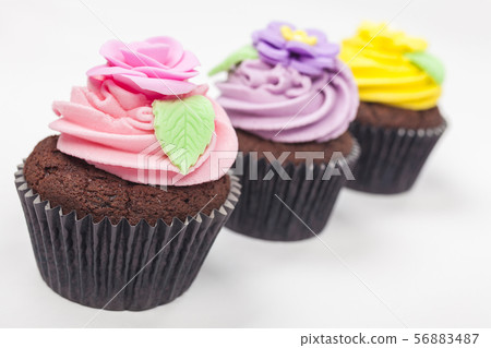 Three Chocolate Cupcakes With Colorful Icing 56883487