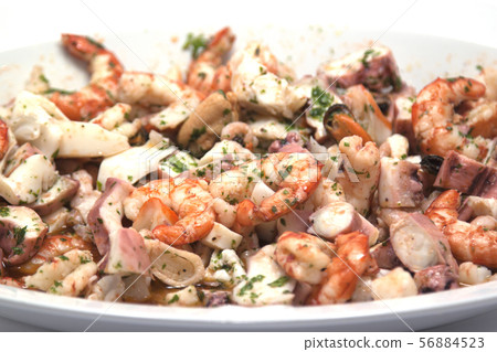 rich and mixed seafood salad on a serving plate rich and mixed seafood salad on a serving plate 56884523