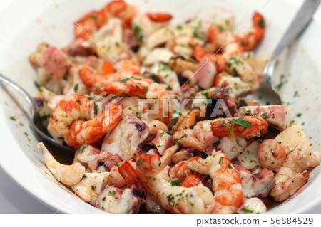 rich and mixed seafood salad on a serving plate 56884529