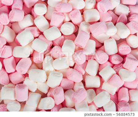 Pink and white mini marshmallows as background. 56884573