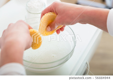 Cosmetologist hand cleaning sponge 56884944