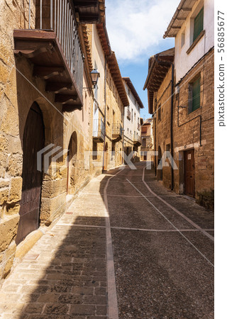 Medieval streets of ancient village of Uncastillo in Aragon region, Spain. Medieval streets of ancient village of Uncastillo in Aragon region, Spain. 56885677